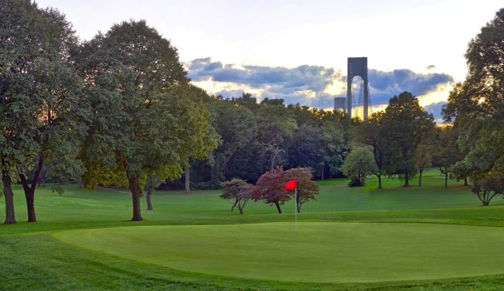 Image of Dyker Beach golf course with bridge in background